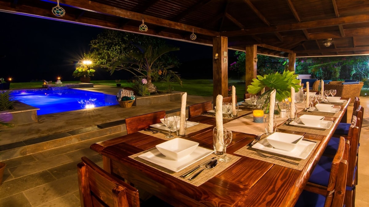 Outdoor dining table at Sand Pebbles Villa.